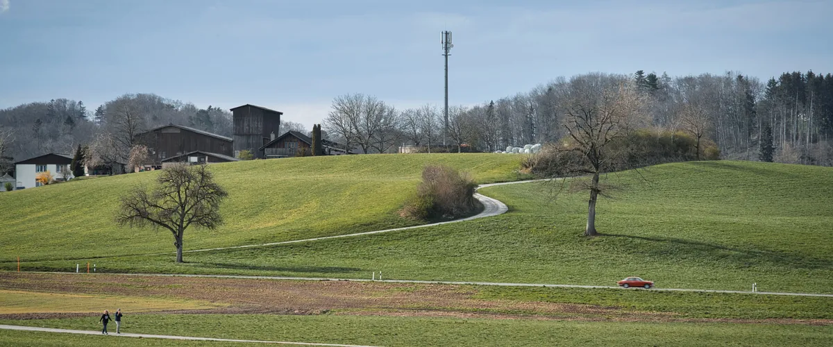 Working farm set among softly green rolling fields